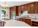 Traditional kitchen featuring wood cabinets, white countertops, stainless steel appliances and an undermount sink at 705 W Ponce De Leon Ave, Decatur, GA 30030