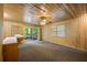 Cozy living room with wood paneling and sliding glass doors that offer seamless indoor-outdoor living at 705 W Ponce De Leon Ave, Decatur, GA 30030