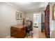 Cozy office space featuring a traditional desk and access to an ensuite bathroom at 705 W Ponce De Leon Ave, Decatur, GA 30030