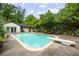 Private backyard oasis featuring a diving board, in-ground pool and lounge seating at 705 W Ponce De Leon Ave, Decatur, GA 30030