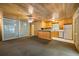 Recreation room features wood paneling, a ceiling fan, and a kitchenette area at 705 W Ponce De Leon Ave, Decatur, GA 30030