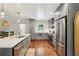 Modern kitchen with stainless steel appliances, a center island, and gray cabinetry at 1079 Pinedale Se Dr, Smyrna, GA 30080