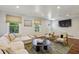 Bright living room featuring hardwood floors, large windows, and neutral-toned decor at 1079 Pinedale Se Dr, Smyrna, GA 30080