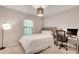 Cozy bedroom with neutral colors, large window, and desk, offering a comfortable and functional space at 1426 N Crossing Ne Dr, Atlanta, GA 30329