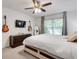 Well-lit bedroom features a ceiling fan and window views to the backyard at 1426 N Crossing Ne Dr, Atlanta, GA 30329