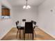 Dining area boasts hardwood floors and a modern glass table with seating for six at 1426 N Crossing Ne Dr, Atlanta, GA 30329