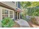 Charming entryway features a walkway, privacy fence, and lush greenery at 1426 N Crossing Ne Dr, Atlanta, GA 30329