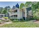 Well-maintained condo features mature trees, manicured shrubbery, and attractive exteriors at 1426 N Crossing Ne Dr, Atlanta, GA 30329