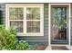 Inviting front entrance features a decorative glass door, well-lit surroundings, and lovely plants at 1426 N Crossing Ne Dr, Atlanta, GA 30329