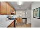 Well-lit kitchen features stainless steel appliances, granite countertops and opens to dining area at 1426 N Crossing Ne Dr, Atlanta, GA 30329