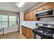 Modern kitchen with stainless steel appliances, granite countertops and bright, natural light at 1426 N Crossing Ne Dr, Atlanta, GA 30329