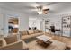 Bright living room boasts hardwood floors, modern furnishings, and a ceiling fan for added comfort at 1426 N Crossing Ne Dr, Atlanta, GA 30329
