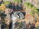 Overhead view of the home showing the driveway and surrounding trees at 1540 Brooks S Rd, Lawrenceville, GA 30045