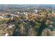Aerial shot of a modern home nestled in the woods on a long lot in a mature neighborhood at 1540 Brooks S Rd, Lawrenceville, GA 30045