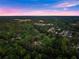 Panoramic aerial shot showcases the property's location within a verdant, tree-filled residential area at 1540 Brooks S Rd, Lawrenceville, GA 30045
