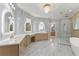 Elegant bathroom featuring double vanity, soaking tub, and glass enclosed shower at 1540 Brooks S Rd, Lawrenceville, GA 30045