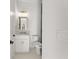 Small bathroom with marble countertop, a modern faucet, and gold lighting at 1540 Brooks S Rd, Lawrenceville, GA 30045