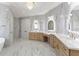 Luxurious bathroom with double vanities, quartz countertops, and marble flooring at 1540 Brooks S Rd, Lawrenceville, GA 30045