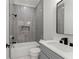 Nicely tiled bathroom with a shower/tub combination and modern fixtures at 1540 Brooks S Rd, Lawrenceville, GA 30045