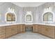 Bathroom with double vanity, illuminated mirrors, and white quartz countertops at 1540 Brooks S Rd, Lawrenceville, GA 30045