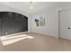 Bright bedroom with a decorative wall accent and chandelier lighting fixture at 1540 Brooks S Rd, Lawrenceville, GA 30045