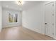 Bright and airy bedroom with hardwood floors, a window, and a white door at 1540 Brooks S Rd, Lawrenceville, GA 30045