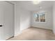 A simple, bright bedroom with white trim and large window at 1540 Brooks S Rd, Lawrenceville, GA 30045