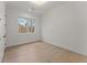 Bright bedroom with light hardwood floors and large window at 1540 Brooks S Rd, Lawrenceville, GA 30045