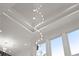 Ceiling with a modern chandelier and large windows, providing natural light and an airy atmosphere at 1540 Brooks S Rd, Lawrenceville, GA 30045