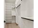 Well organized closet space with white shelving and black rods at 1540 Brooks S Rd, Lawrenceville, GA 30045
