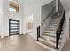 Elegant entryway with wooden staircase and modern front door at 1540 Brooks S Rd, Lawrenceville, GA 30045