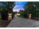 Stunning home with gated entrance, long driveway, and lush landscaping, offering privacy and elegance at 1540 Brooks S Rd, Lawrenceville, GA 30045