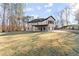 Large backyard showing home's rear exterior, patio, and landscaping at 1540 Brooks S Rd, Lawrenceville, GA 30045