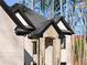 Close up of the home's entry arch and black frame windows at 1540 Brooks S Rd, Lawrenceville, GA 30045