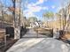 Elegant home featuring an automated gate entry for added security and privacy at 1540 Brooks S Rd, Lawrenceville, GA 30045