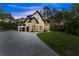 Impressive custom home boasting stone accents, a private driveway, and verdant surroundings, showcasing refined living at its finest at 1540 Brooks S Rd, Lawrenceville, GA 30045