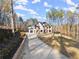 Two-story home featuring a modern garage door and stone accents at 1540 Brooks S Rd, Lawrenceville, GA 30045