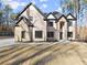Beautiful two-story home with stone accents and landscaped front yard at 1540 Brooks S Rd, Lawrenceville, GA 30045