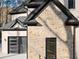 Modern garage with black frame windows and stone exterior at 1540 Brooks S Rd, Lawrenceville, GA 30045