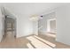Elegant hallway with hardwood floors, modern lighting fixture, and view of the entryway at 1540 Brooks S Rd, Lawrenceville, GA 30045