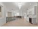 Open hallway with hardwood floors, modern railings, and a stylish bar area, perfect for entertaining guests at 1540 Brooks S Rd, Lawrenceville, GA 30045