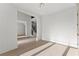 Spacious hallway featuring hardwood floors and access to the staircase and other rooms at 1540 Brooks S Rd, Lawrenceville, GA 30045