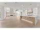 Modern kitchen with large island, stainless steel appliances, and hardwood floors throughout at 1540 Brooks S Rd, Lawrenceville, GA 30045