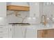 A stylish kitchen with white cabinets, wooden accents and a large marble-style island at 1540 Brooks S Rd, Lawrenceville, GA 30045