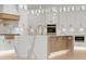 Beautiful kitchen with a large island, white cabinets, marble countertops, and stainless steel appliances at 1540 Brooks S Rd, Lawrenceville, GA 30045