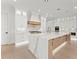 Bright, open kitchen features a large island with quartz countertops, stainless steel appliances, and custom cabinets at 1540 Brooks S Rd, Lawrenceville, GA 30045