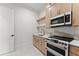 This kitchen features ample counter space, modern appliances, and light wood cabinets for a cozy and inviting atmosphere at 1540 Brooks S Rd, Lawrenceville, GA 30045