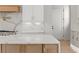 Open concept kitchen features quartz countertops and white shaker cabinets at 1540 Brooks S Rd, Lawrenceville, GA 30045