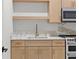 A cozy kitchenette with light wood cabinets, quartz countertops and modern appliances at 1540 Brooks S Rd, Lawrenceville, GA 30045