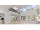 Bright, modern living room featuring large windows, hardwood floors, and open floor plan at 1540 Brooks S Rd, Lawrenceville, GA 30045